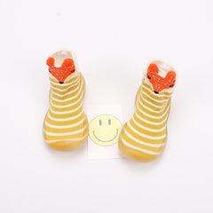 Toddler wearing Baby Cartoon Walking Shoes while walking indoors