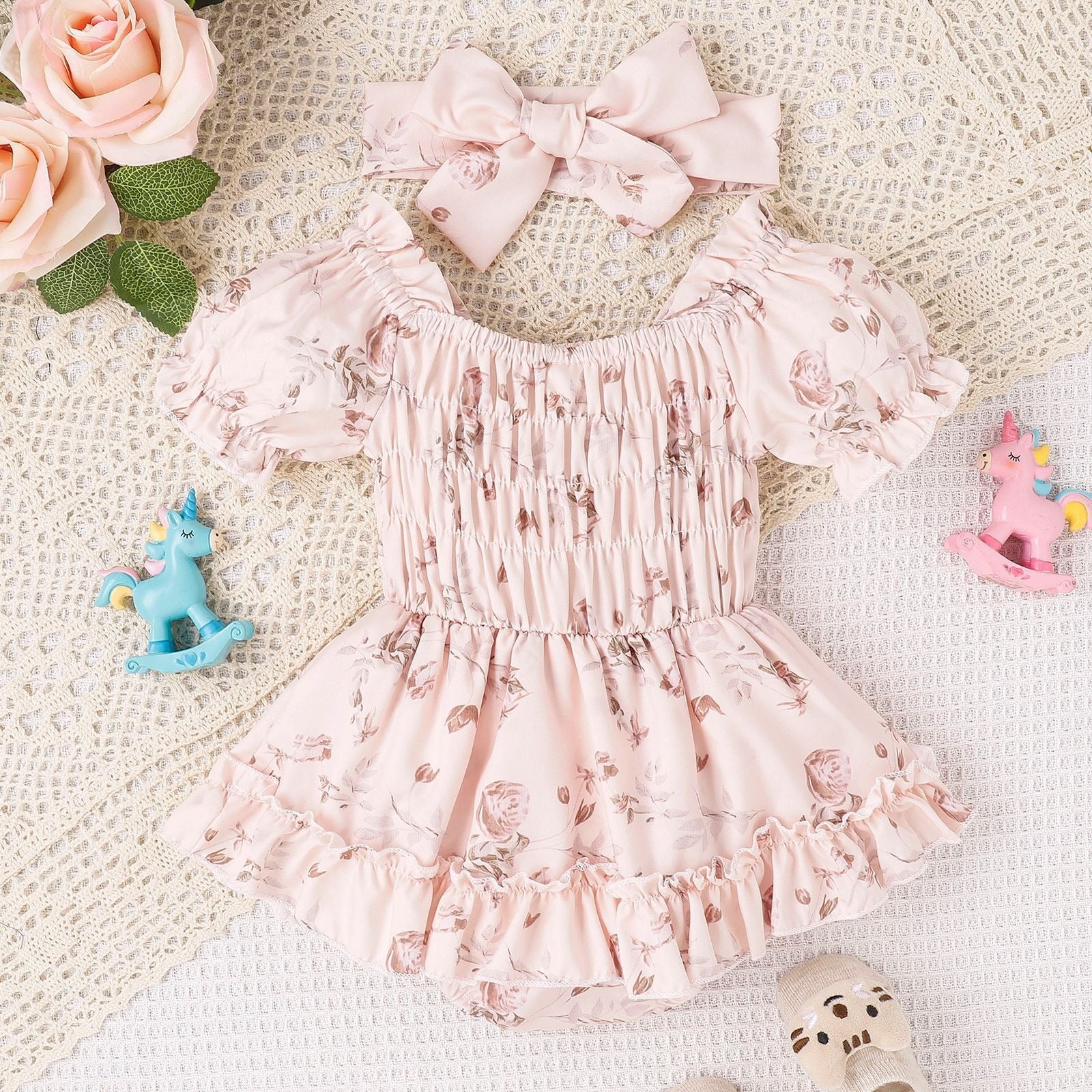 "Back view of Baby and Toddler Two Color Floral Skirt Hem Jumpsuit"