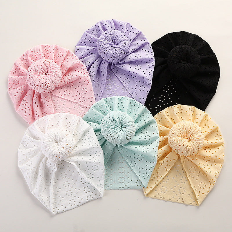 Baby wearing Baby Lace Pullover Cap in pastel pink