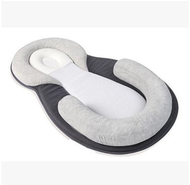 Infant resting comfortably in Baby Snuggle Nest Sleeper