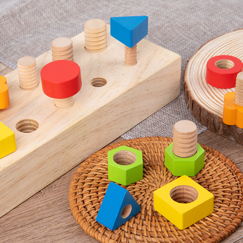 Children assembling nuts on Children's screw tightening tool table