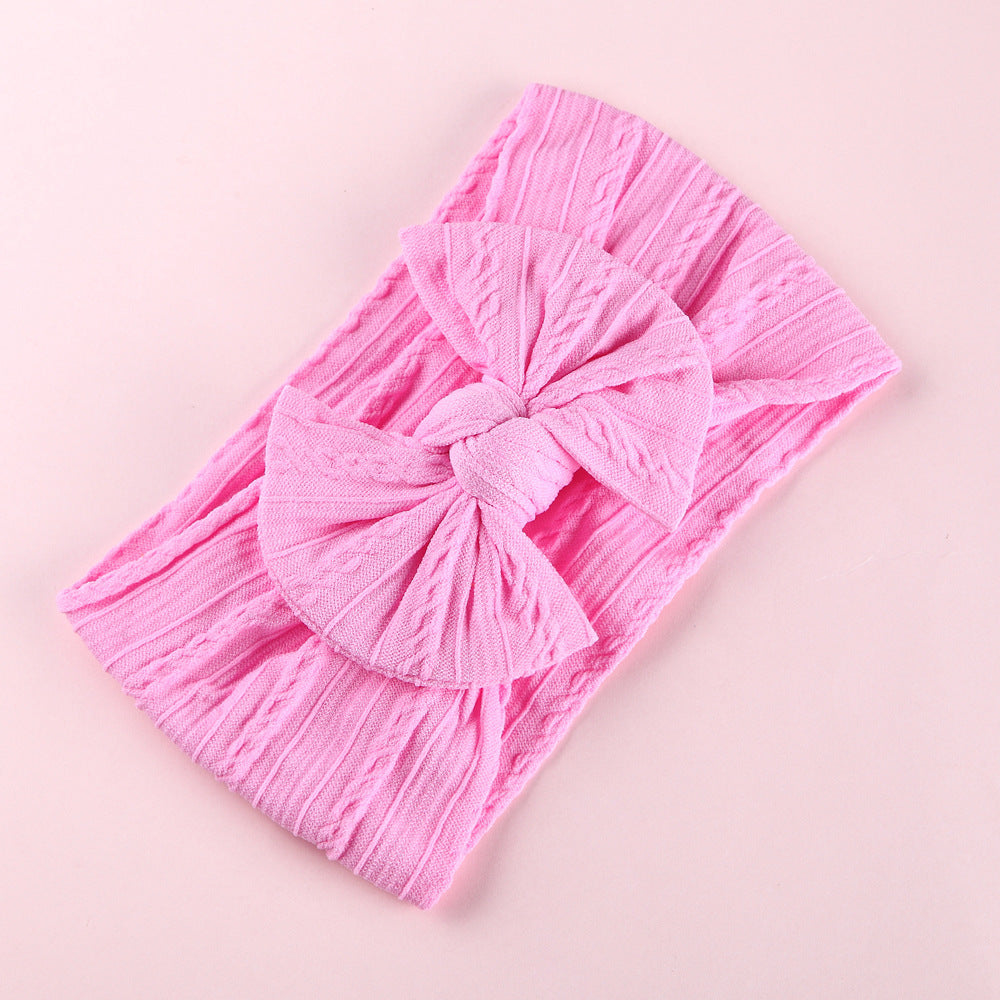 Front view of baby wearing Elastic Nylon Baby Headband