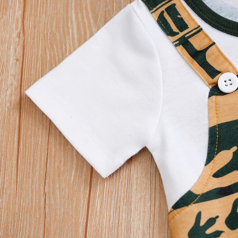 Close-up of Newborn Baby Clothes Girl Boy dinosaur print cotton fabric