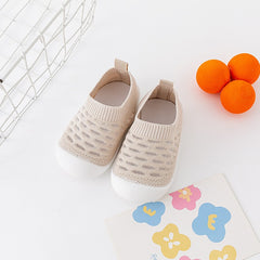→ Alt: Top view of Baby Walking Shoes made with breathable, lightweight fabric