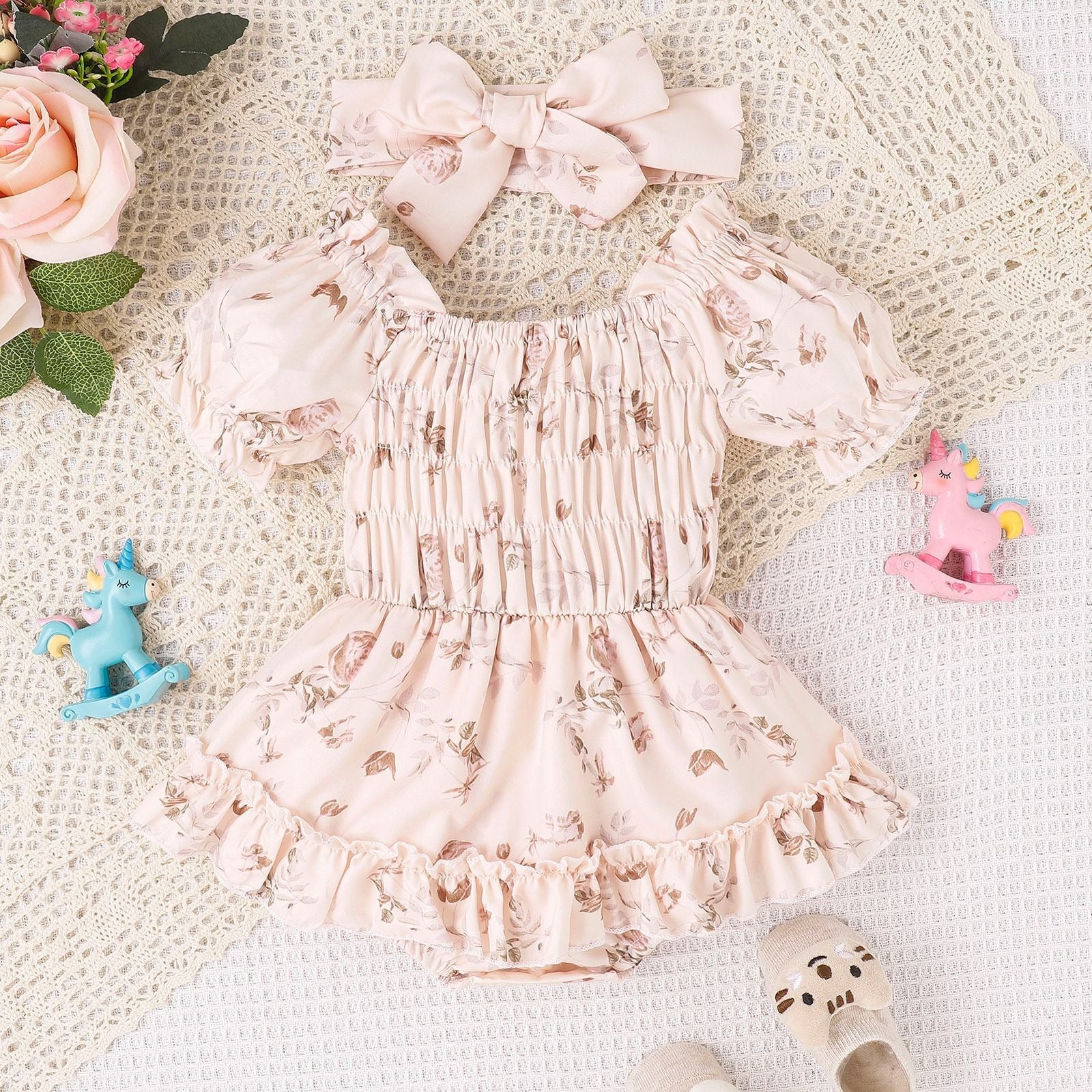 "Close-up of Baby and Toddler Two Color Floral Skirt Hem Jumpsuit fabric and design"