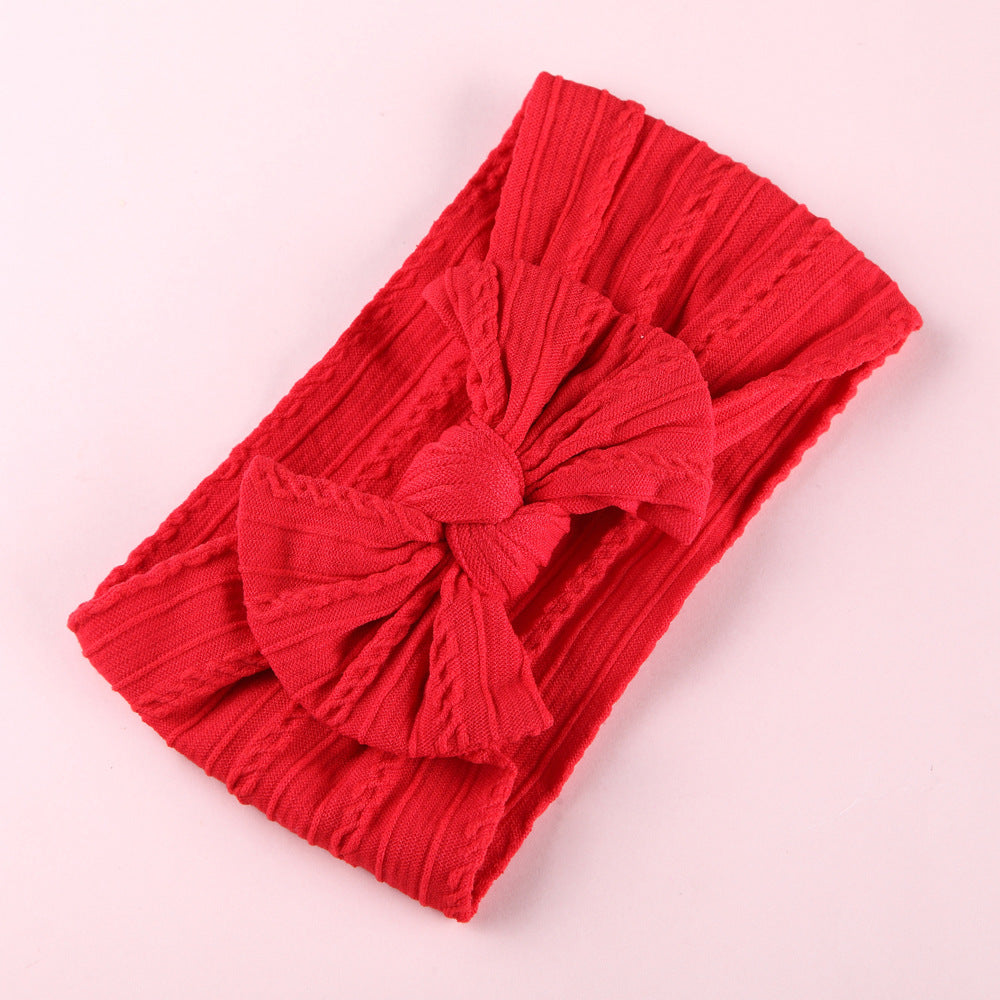 Side view of Elastic Nylon Baby Headband on baby