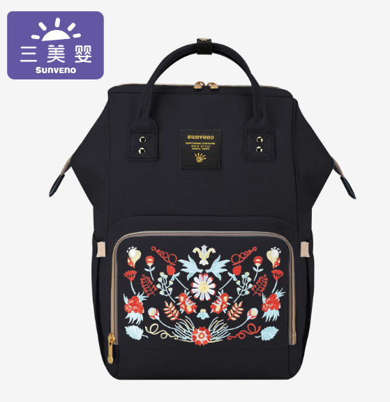 → Alt: Mother using Maternity Diaper Bag to carry baby items hands-free