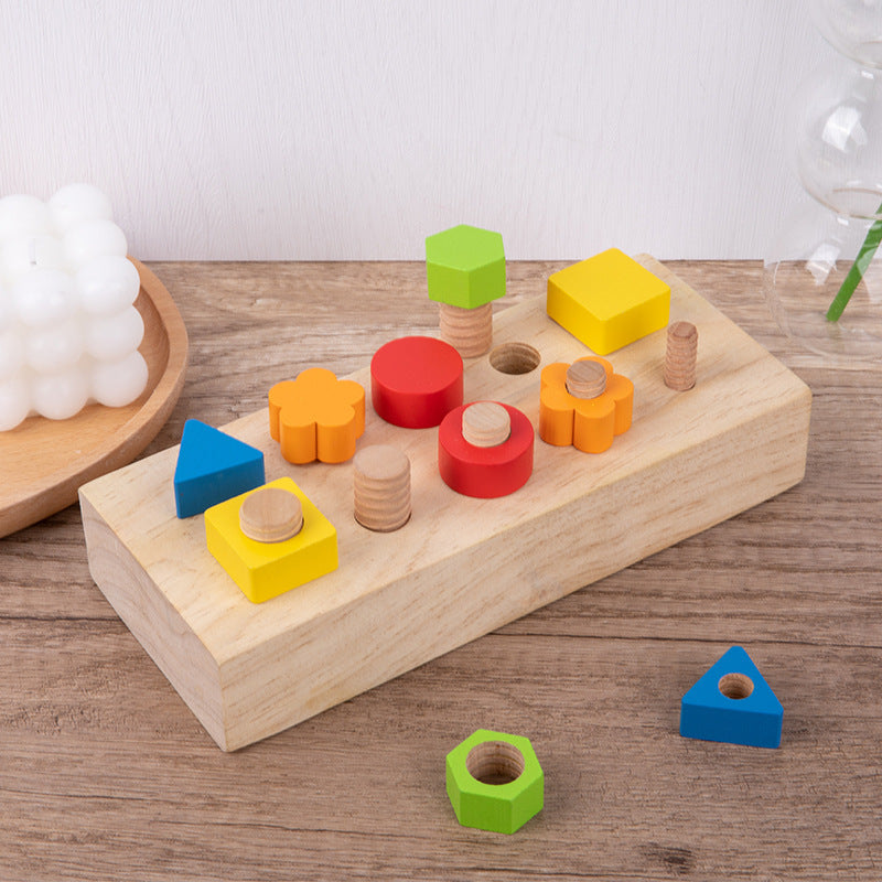 Toddler playing with Children's screw tightening tool table wooden toy