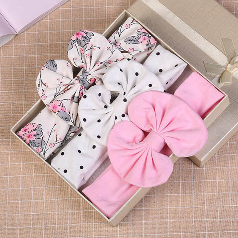 <img src="headband-baby.jpg" alt="Newborn wearing printed baby headband set with cute bow">