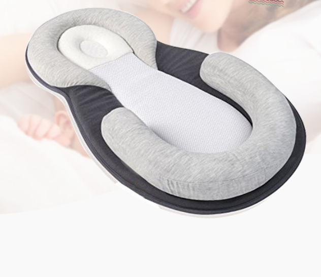 Side view of Baby Snuggle Nest Sleeper highlighting soft padding