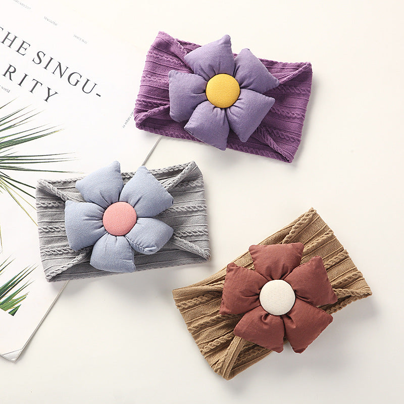 Soft Jacquard Nylon Baby Headband in packaging for display