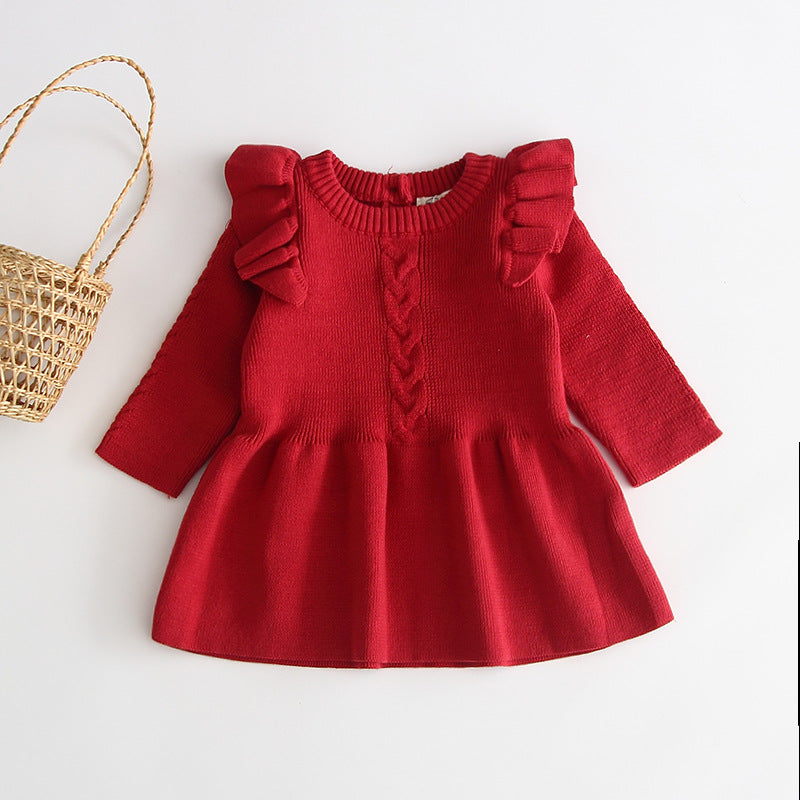 Close-up of knitting pattern on baby girl knitted dress baby warm dress knitted princess sweater sweater
