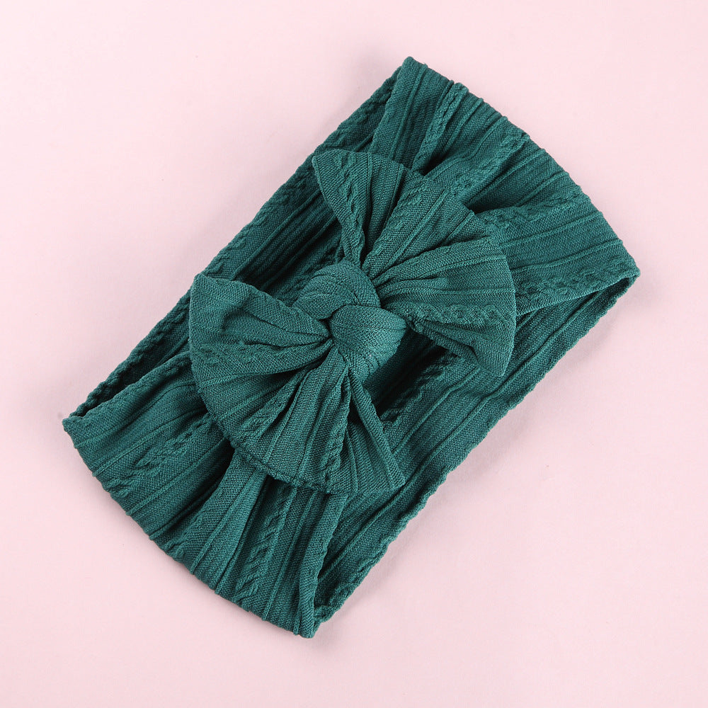 Front view of baby wearing Elastic Nylon Baby Headband