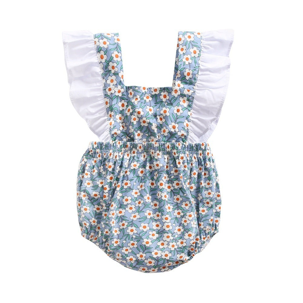 Close-up view of floral baby jumpsuit cotton material