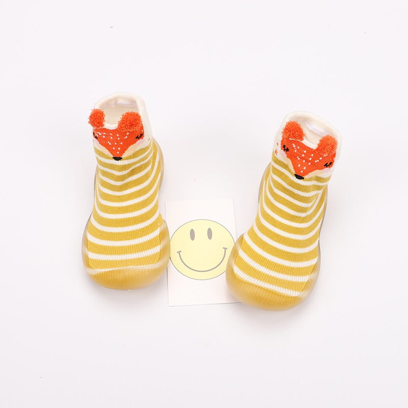 Toddler wearing Baby Cartoon Walking Shoes while walking indoors