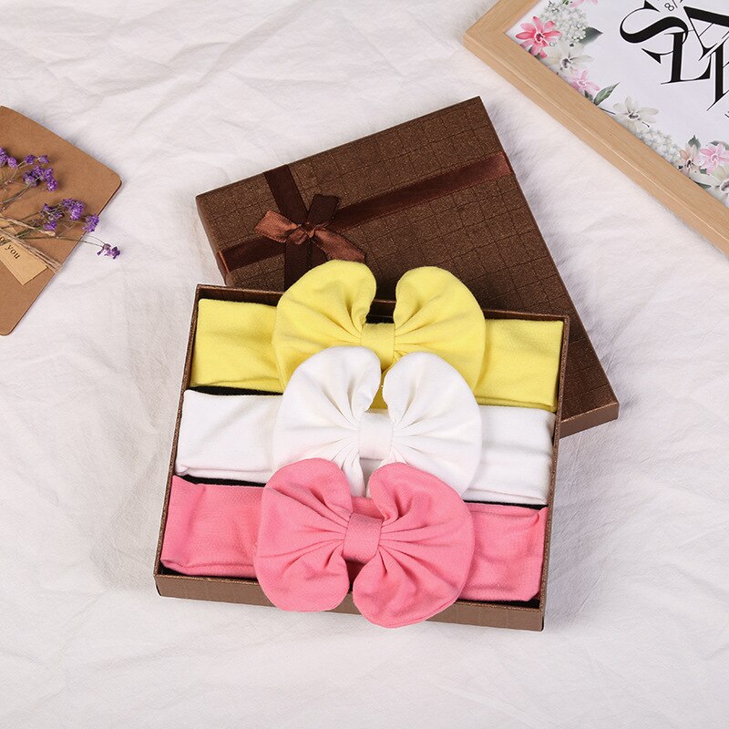 <img src="headband-group.jpg" alt="3-piece printed baby headband set in assorted colors and patterns">