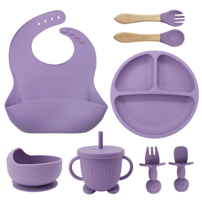 "Parent placing food in 8PCS Mother and Baby Silicone Bibs, Silicone Dinner Plates, Eight-Piece Set, Baby Food Training Suction Cup Bowl, Baby Divided Tableware Set"