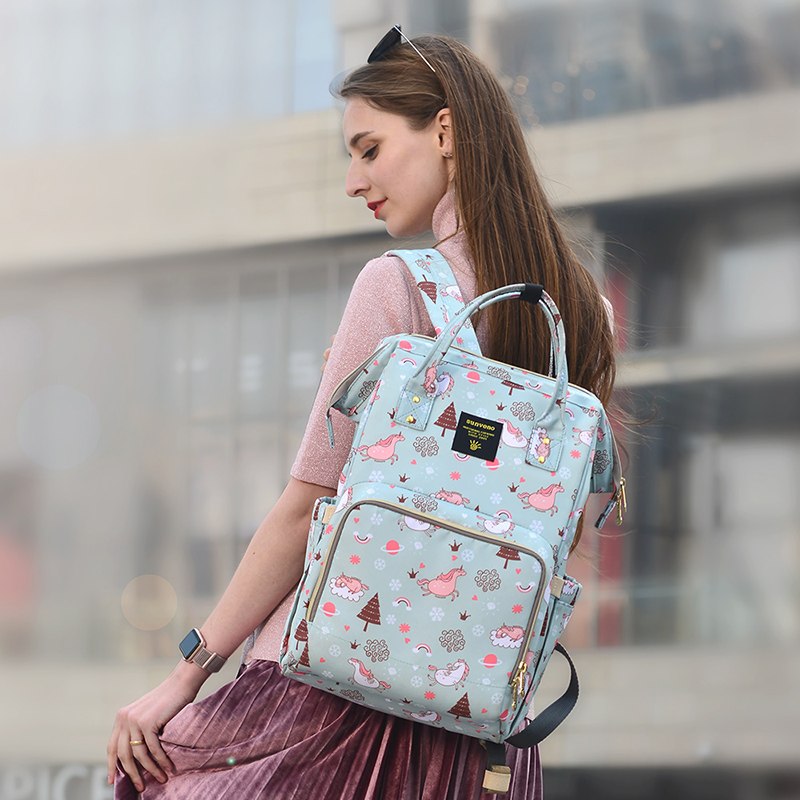→ Alt: Open view of Maternity Diaper Bag showing organized pockets for diapers and bottles