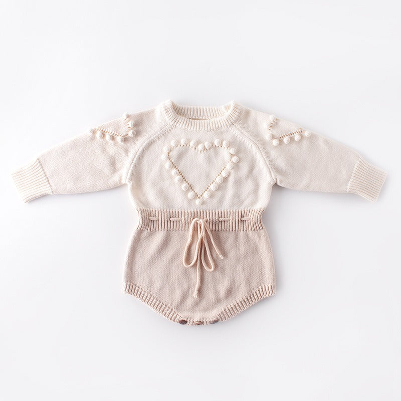 Baby handmade knitted sweater on white background