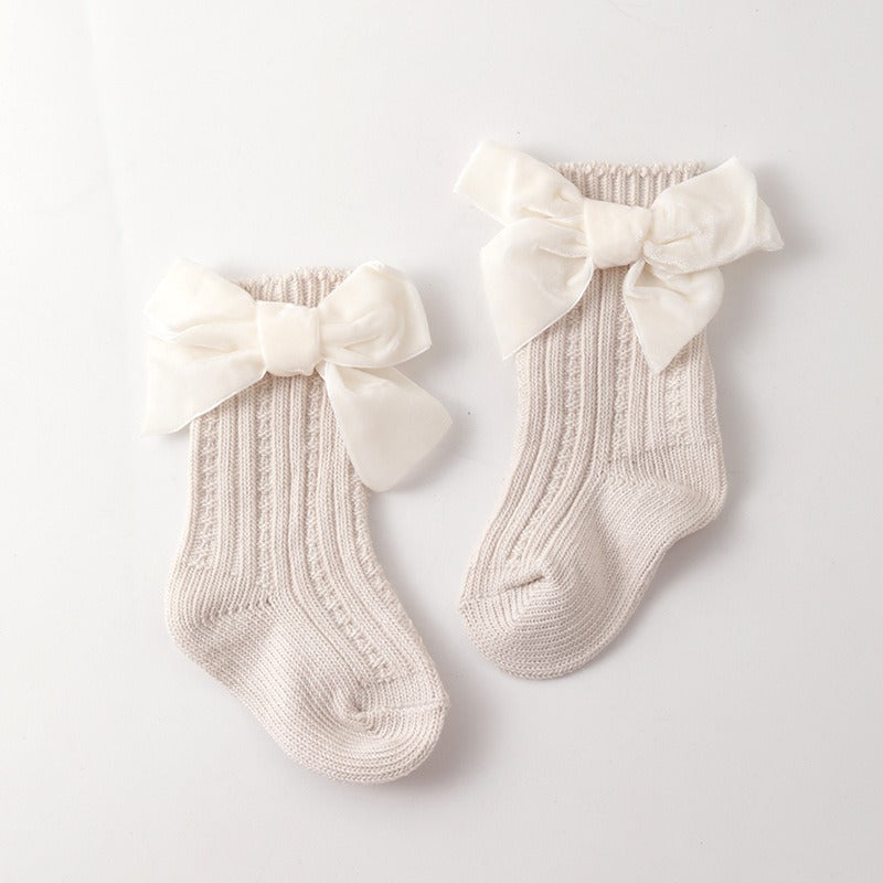 Flat lay of Baby Thick Needle Socks in colorful patterns