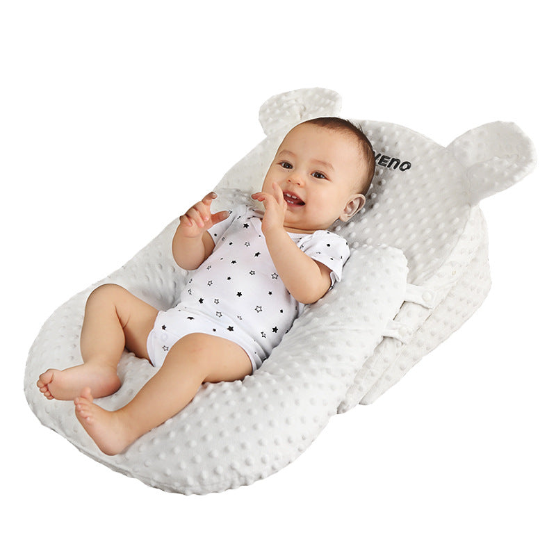 "Close-up of Four Season Anti Milk Overflow and Choking Pillow Baby Feeding Tool Baby Anti Spitting Slope Pad surface"