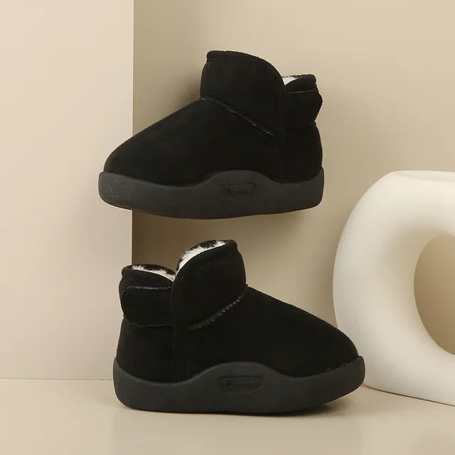 Baby wearing Winter Baby Snow Boots outdoors in winter