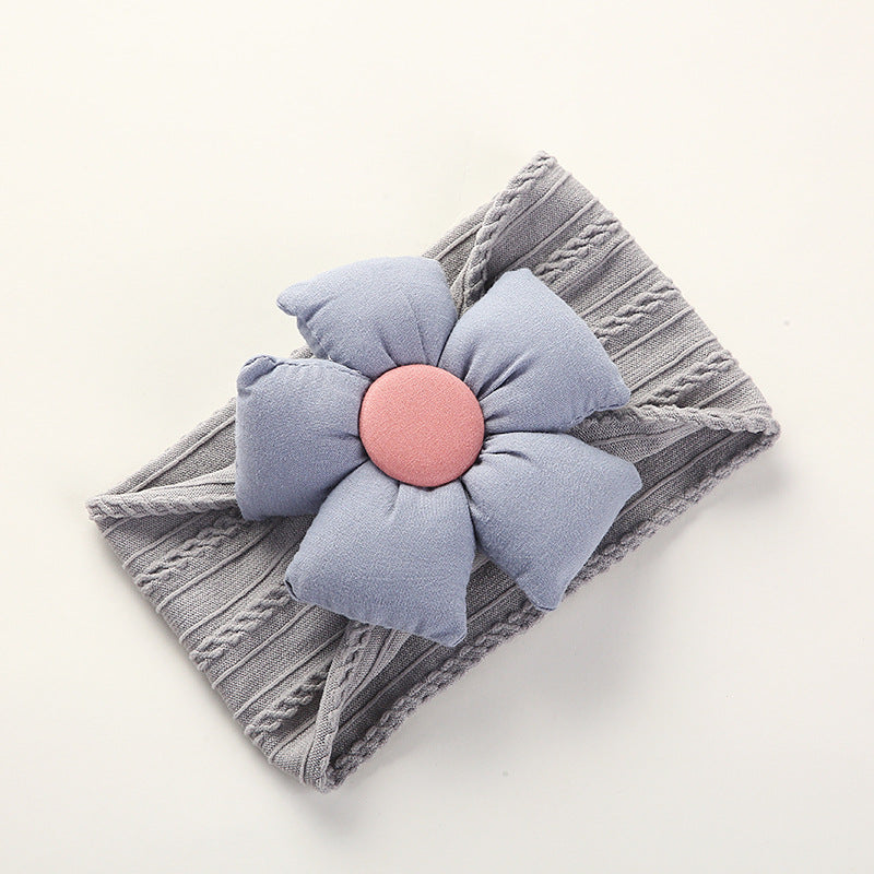 Soft Jacquard Nylon Baby Headband in packaging for display