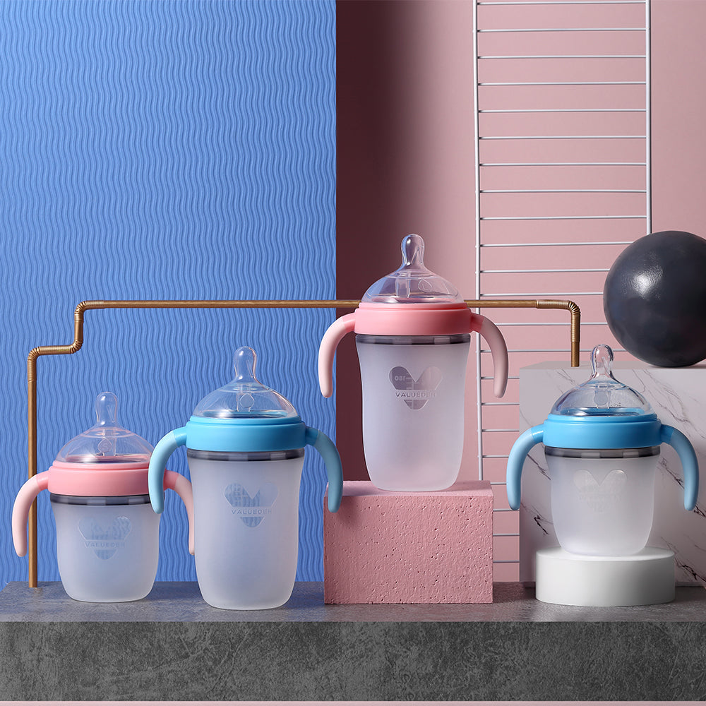 Alt: Pink and blue Baby Silicone Feeding Bottle with ergonomic design