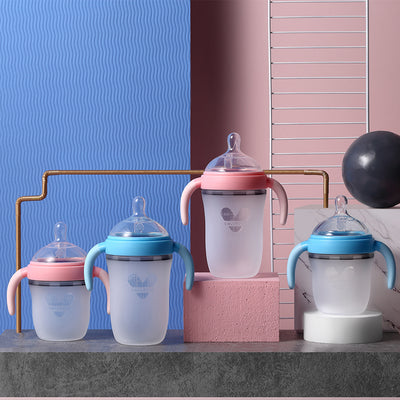Alt: Pink and blue Baby Silicone Feeding Bottle with ergonomic design