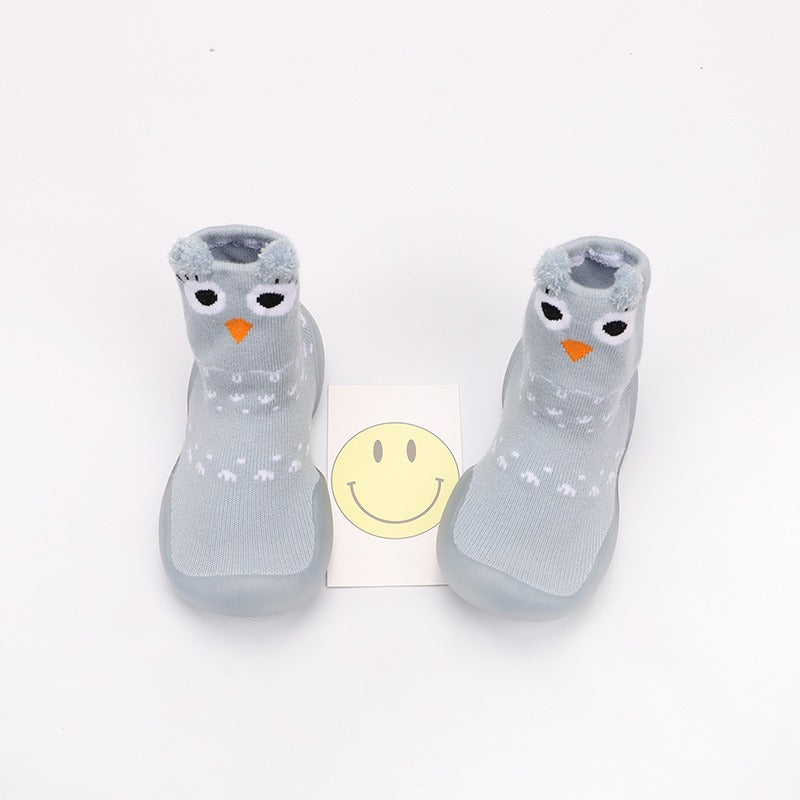 Flat lay of Baby Cartoon Walking Shoes with colorful patterns