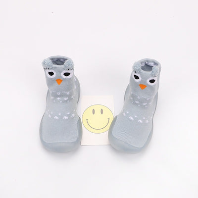 Flat lay of Baby Cartoon Walking Shoes with colorful patterns