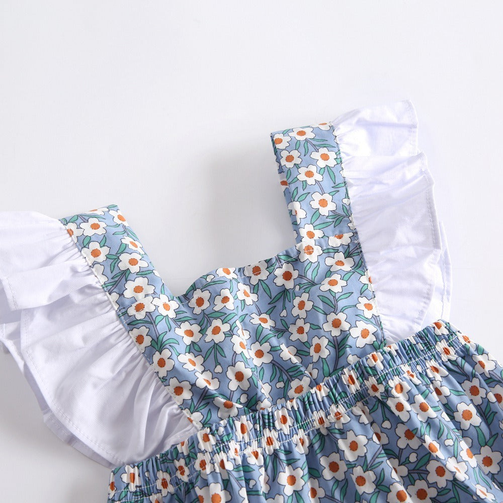 Baby wearing floral baby jumpsuit with floral pattern
