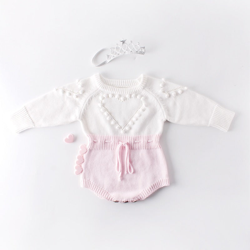 Baby handmade knitted sweater shown with matching accessories