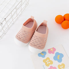 → Alt: Infant wearing Baby Walking Shoes for safe indoor walking
