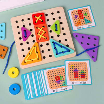 alt="Infant playing with Baby shape matching toy for early learning"