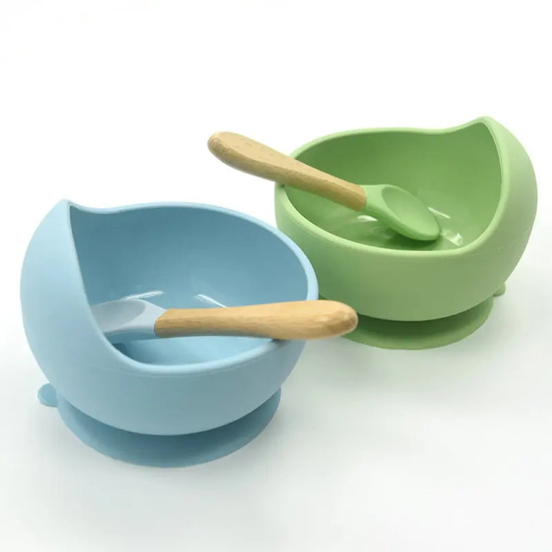 Parent using Baby Silicone Tableware to feed toddler safely
